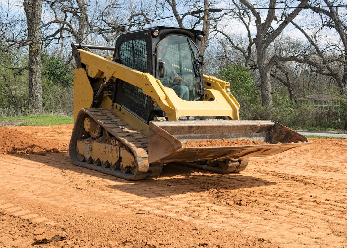 Skid Steer working at construction site.